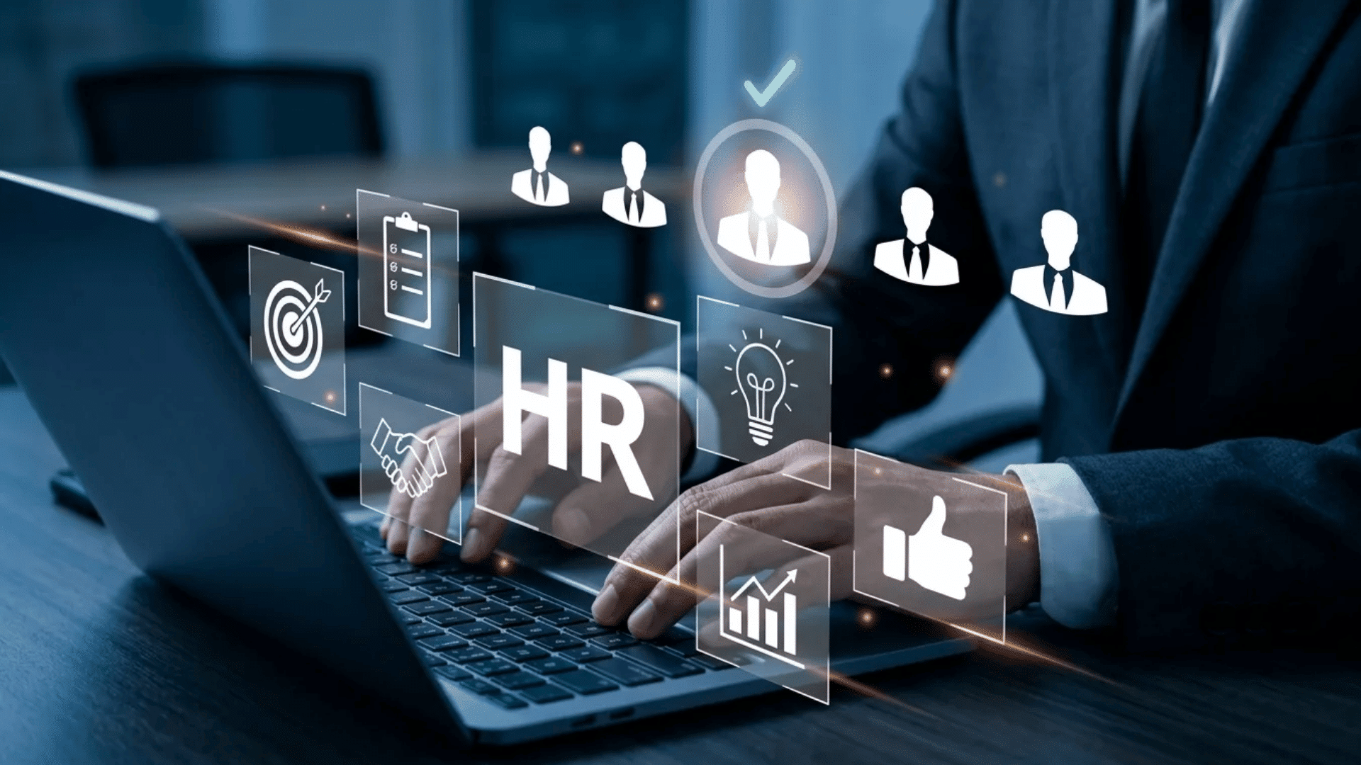 Business professional using HR software on a laptop with digital workforce management and recruitment icons displayed on screen.