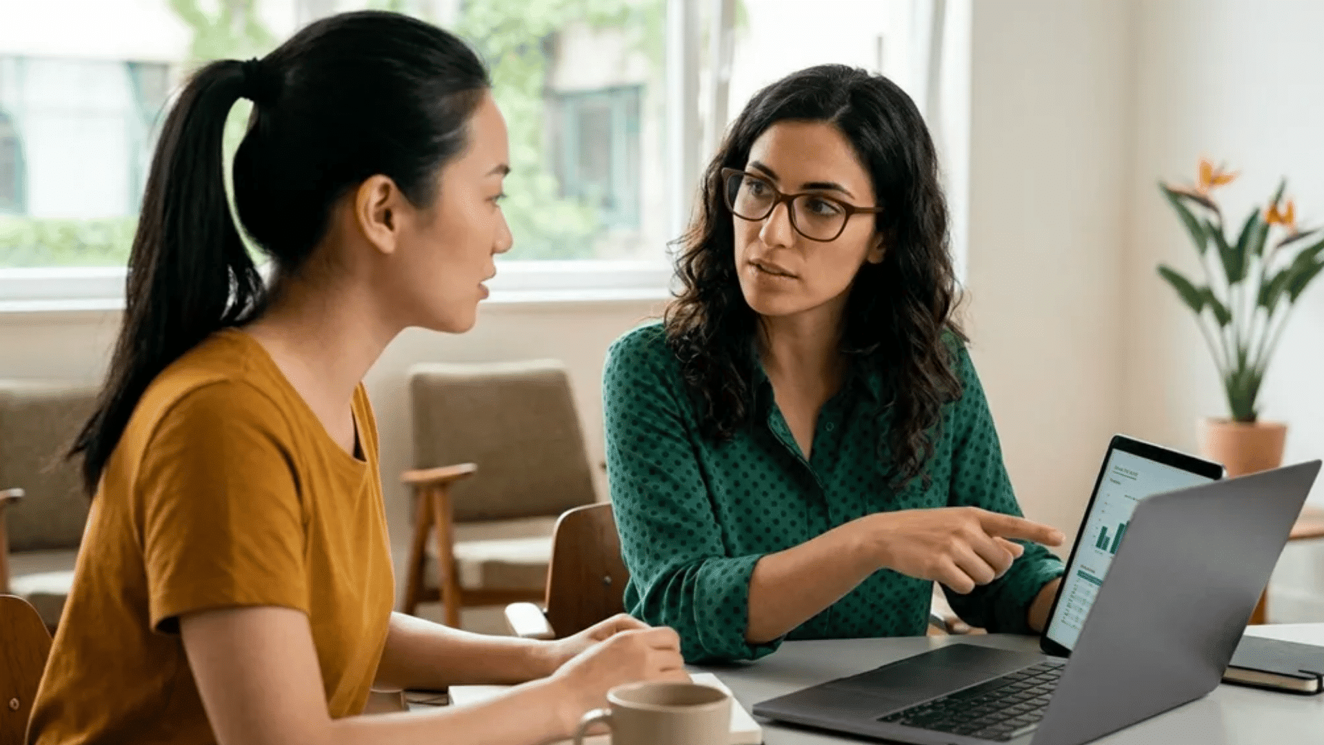 Employee and manager reviewing data for skill-based performance review examples.