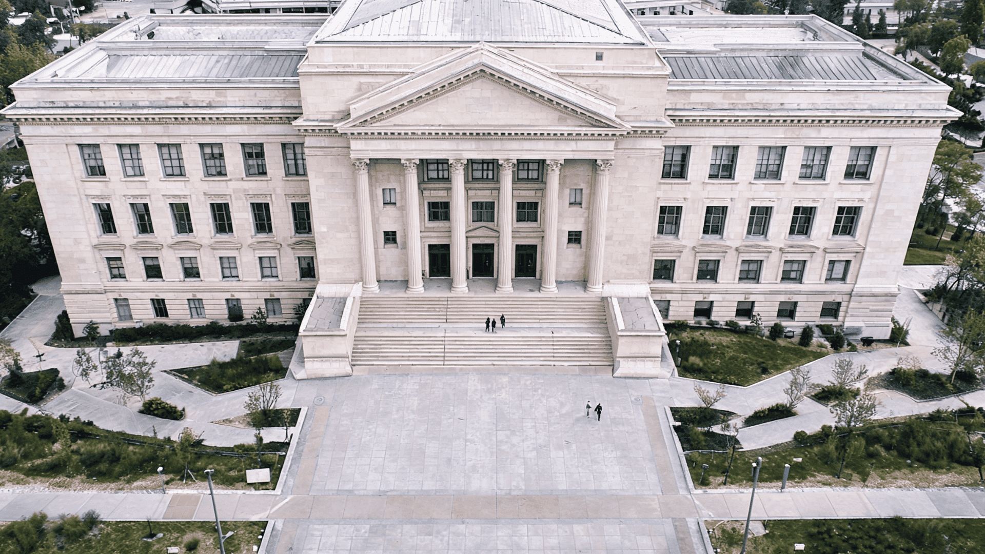 Courthouse building entrance with wide stone steps.