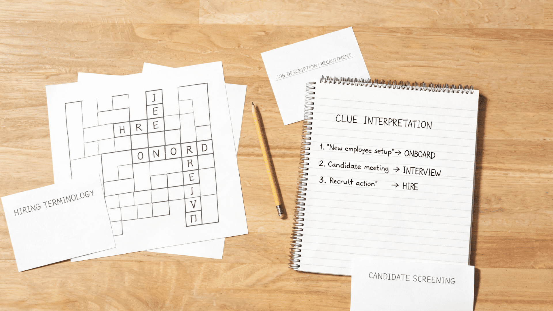 Hiring terminology crossword puzzle with recruitment notes, notebook, pencil, and job-related clues on a desk.